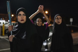 Three Muslim women ready to defend themselves with a baseball bat