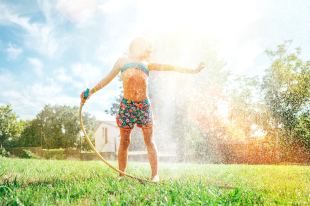 girl under sprinkler