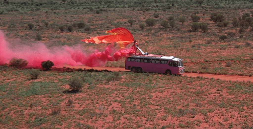 Pink bus in desert