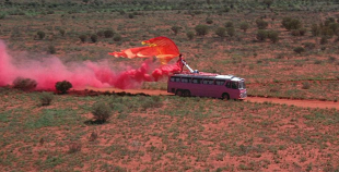 Pink bus in desert