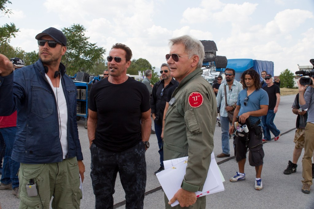 Director Patrick Hughes with Sylvester Stallone and Harrison Ford on set of Expendables 3
