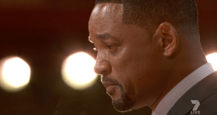 A tearful Will Smith accepts his Academy Award.