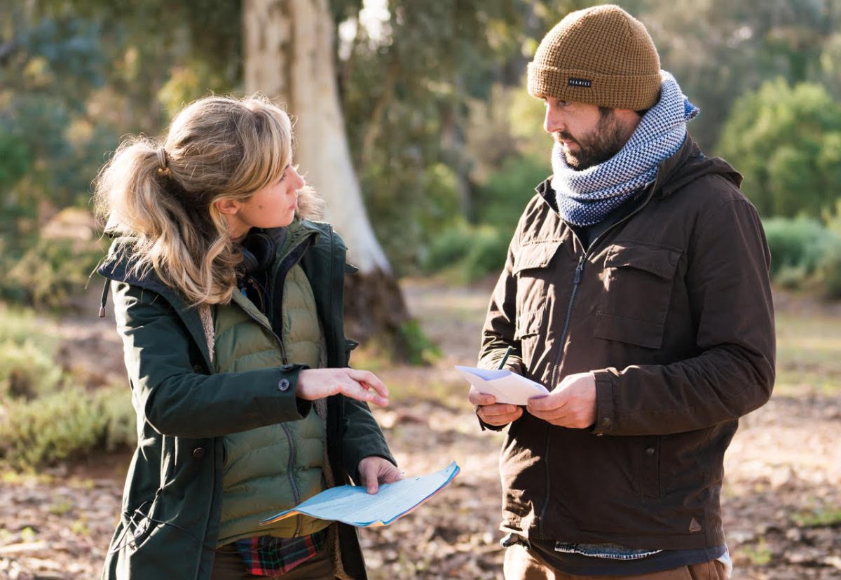 Directors in conversation in bush