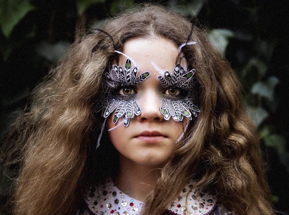 girl with butterfly mask