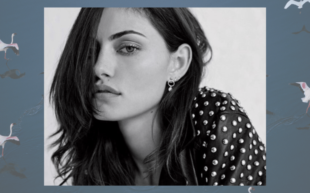 Phoebe Tonkin's greyscale headshot. Background is a separate image of a lake.