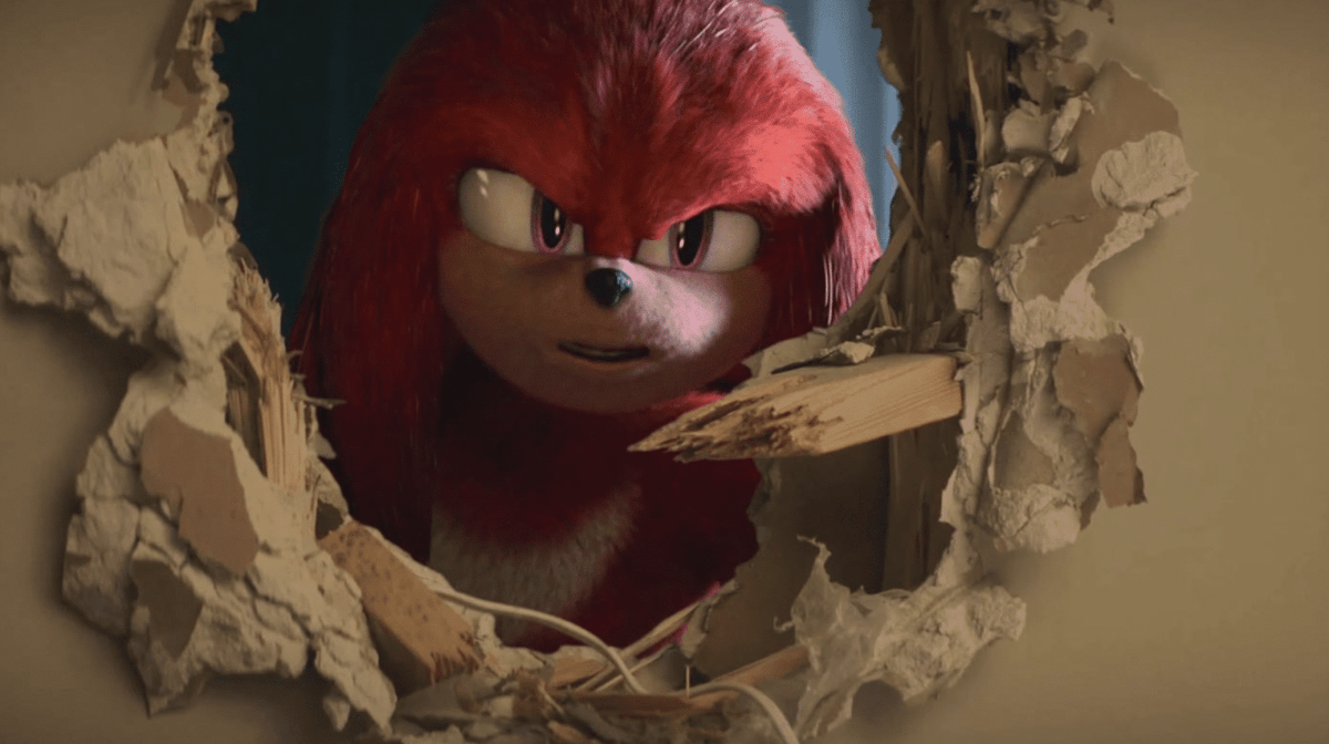 Knuckles The Echidna Looks Menacingly Through A Hole In A Wall In A Publicity Still For The Animated Series Knuckles On Paramount+.