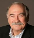 The ate Henri Szeps: a fair-skinned older man with thining grey hair and a grey moustache.