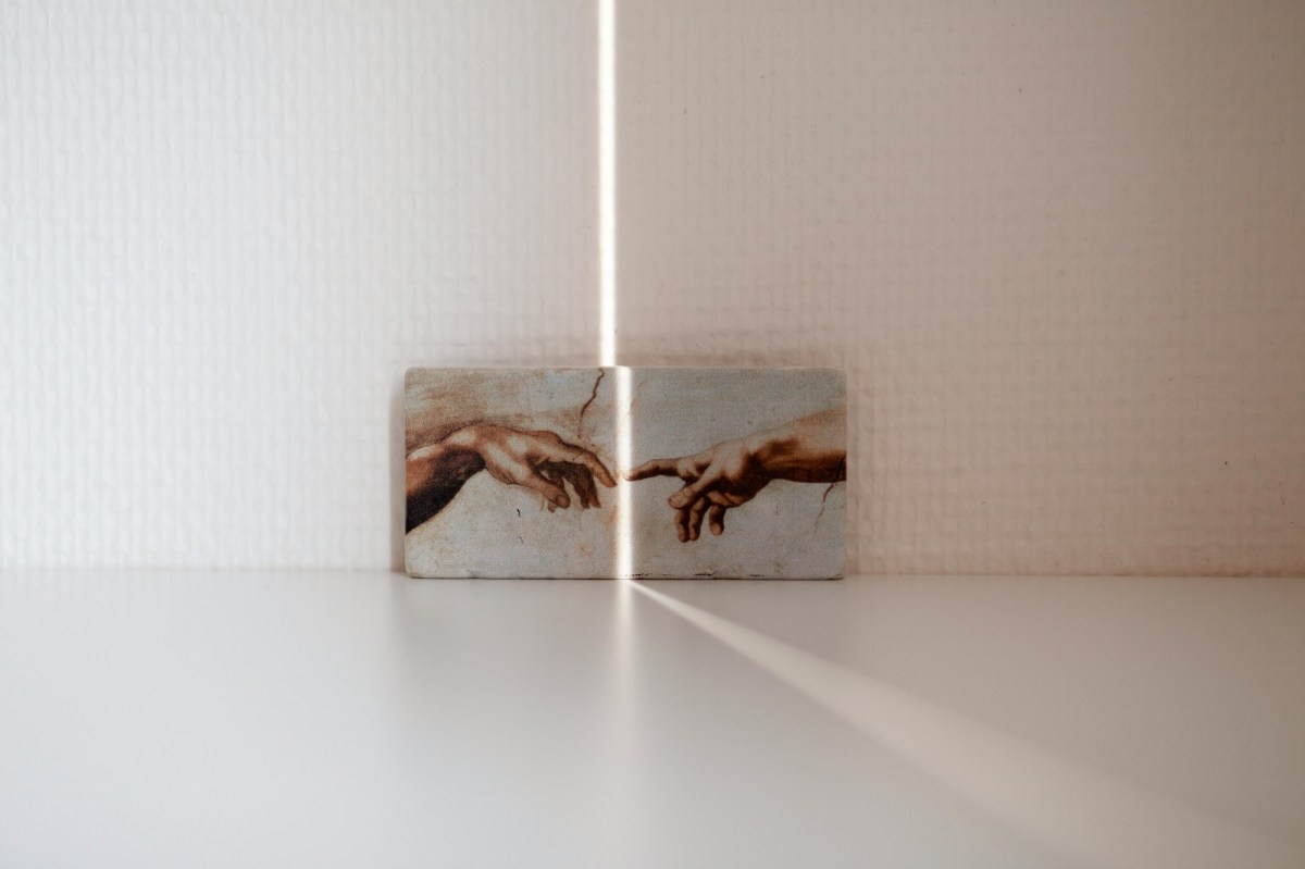 Two Paintings With Fingers Touching Across Them With A Crack Of Light. Superannuation A Copyright Win For Australian Artists Vs Ai – But How Long Can We Hold Off The Bots?