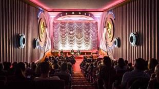 A screening at the Alliance Française French Film Festival. The photo depicts rows of audience members in seats and the screen behind them.