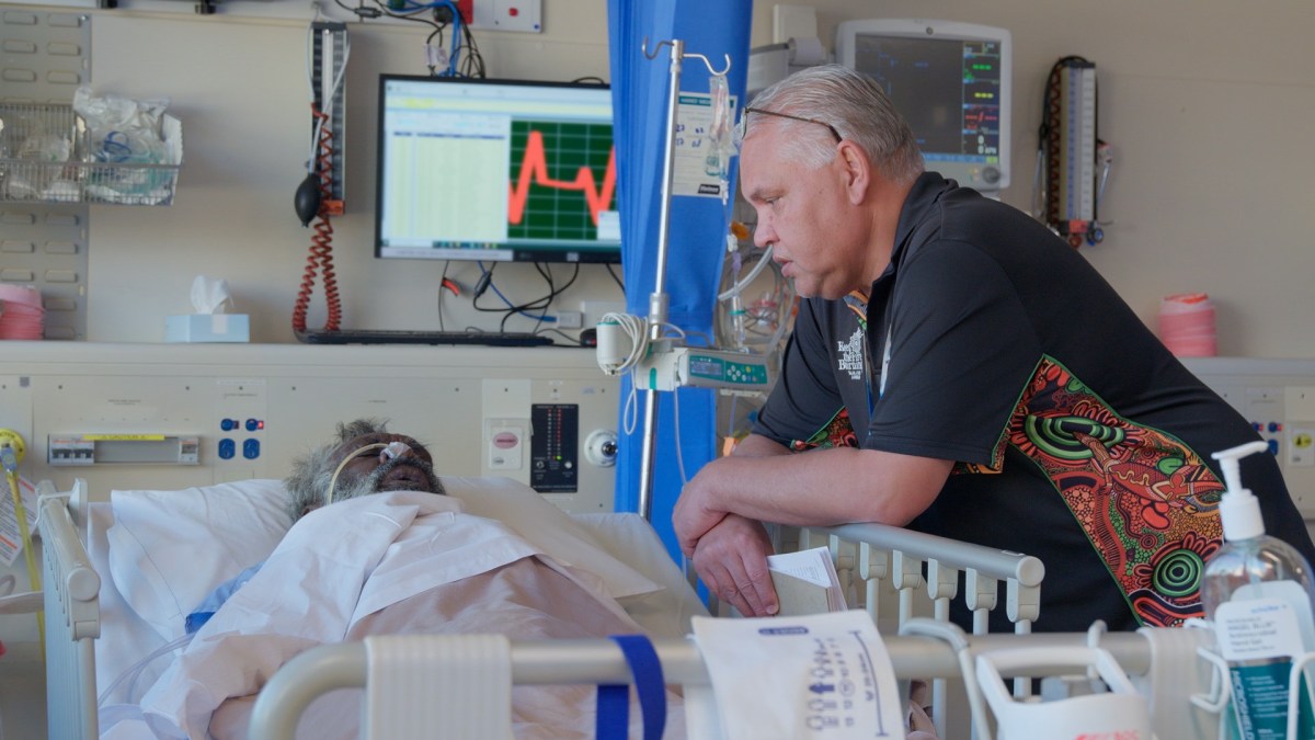 Ahlo Brett Walley Sitting With Patient Stephen At Royal Perth Hospital In Our Medicine S2. Image: Nitv / Sbs.