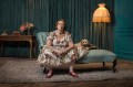 Dr Jeni Haynes lives with dissociative identity disorder, and is the subject of the compelling new SBS-screened documentary We Are Jeni. A middle-aged woman wearing a floral dress and glasses sits on a chaise lounge next to a small brown dog.